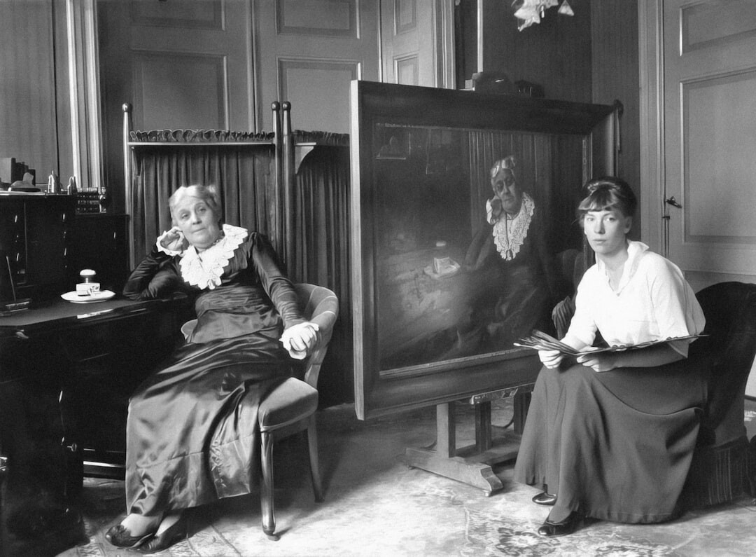 Studio portrait of a Dutch woman in her forties, editor and literature curator, warm confident smile